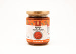 Jar of Nyonya Sambal Tumis on a white background