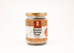 Jar of roasted shrimp paste with a decorative label on a white background