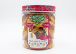 Jar of pineapple tarts with a colorful label on a white background